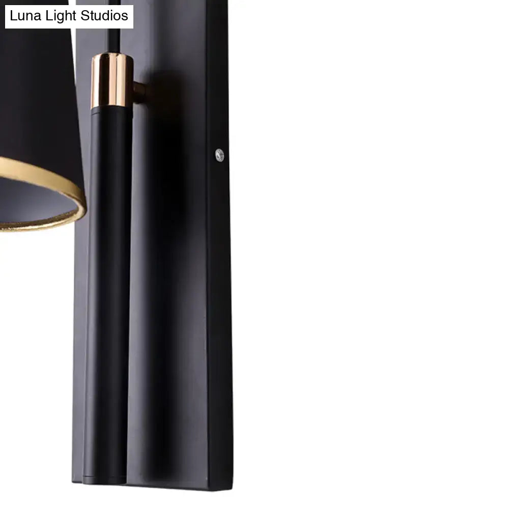 Modern dark brown and gold conical shade wall lamp with matte black finish and gold accents for living room sconce