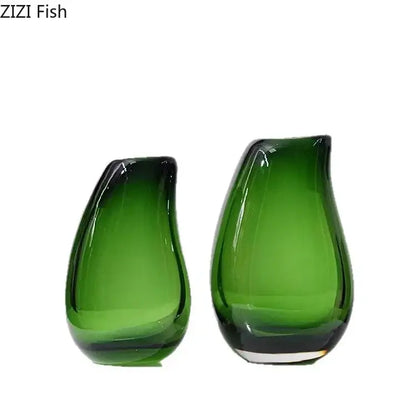 Two translucent green glass vases with a glossy finish in a modern dark gray double glass vase hydroponic desk decor