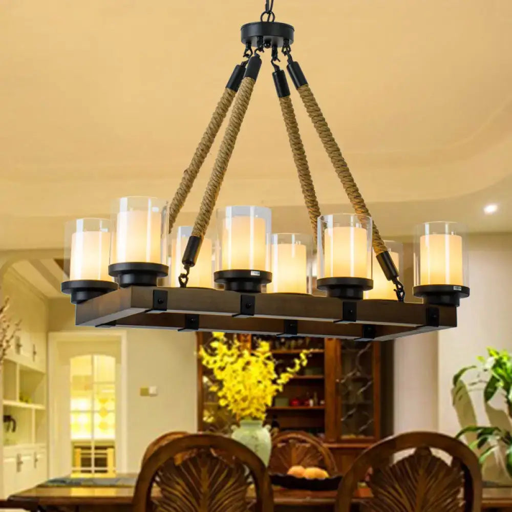 Modern dark wood island chandelier with white glass shade and rope suspension cords for dining room lighting