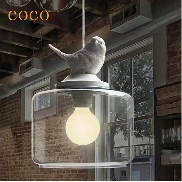 White ceramic decorbites bird perched atop clear glass bird led glass pendant chandelier for dining room light
