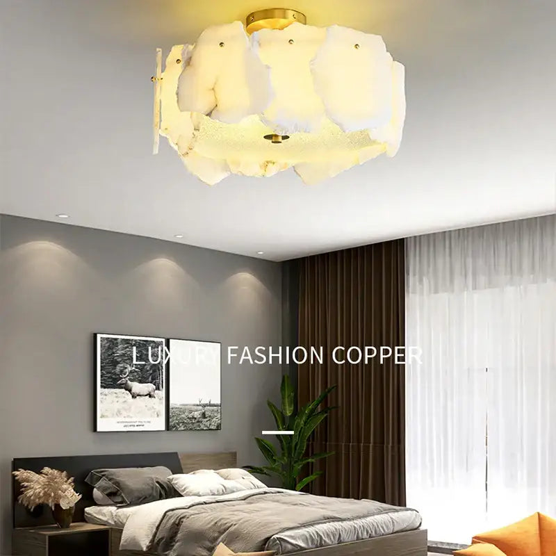 Modern decorbites brass marble ceiling chandelier with white cloud-like fabric shade and gold-toned brass marble ceiling accents