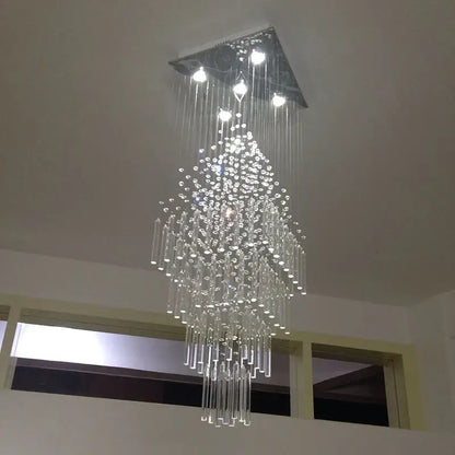 A modern decorbites crystal columnar chandelier with a triangular metal frame and clear glass strands for living room stair loft