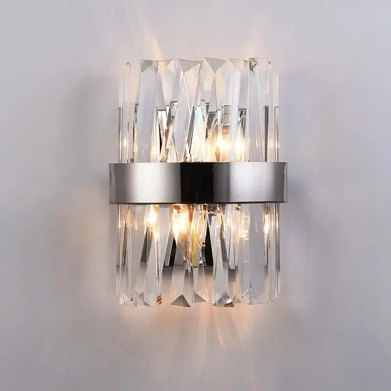 Modern decorbites crystal gold led wall sconce with clear faceted crystal prisms and silver metallic band for bedroom lighting