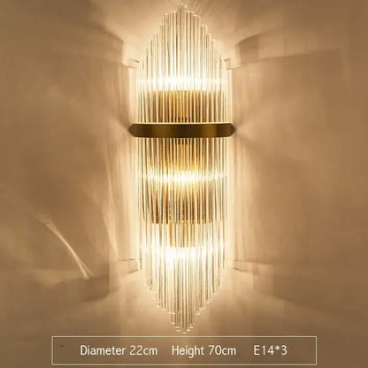 Modern decorbites crystal gold led wall sconce featuring vertical glass rods and gold-toned metal accents for bedroom lighting