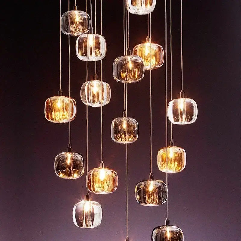 A modern decorbites crystal led chandelier with clear faceted glass orbs and metallic cords for living room lighting