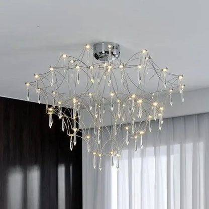 A modern chrome chandelier with intricate branching arms and dangling crystal droplets decorbites deluxe crystal star lamp