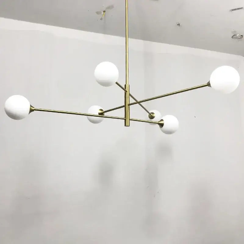 Modern decorbites glass brass chandelier with six frosted glass globes for elegant living room lighting