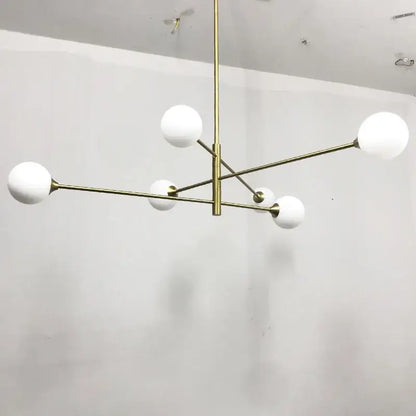 Modern decorbites glass brass chandelier with six frosted glass globes for elegant living room lighting