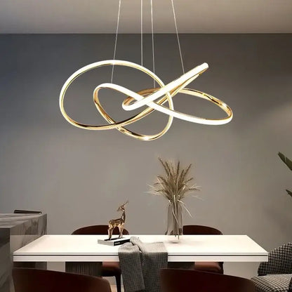 Modern decorbites gold ring led chandelier featuring a gold-toned infinity loop pendant light for dining room lighting