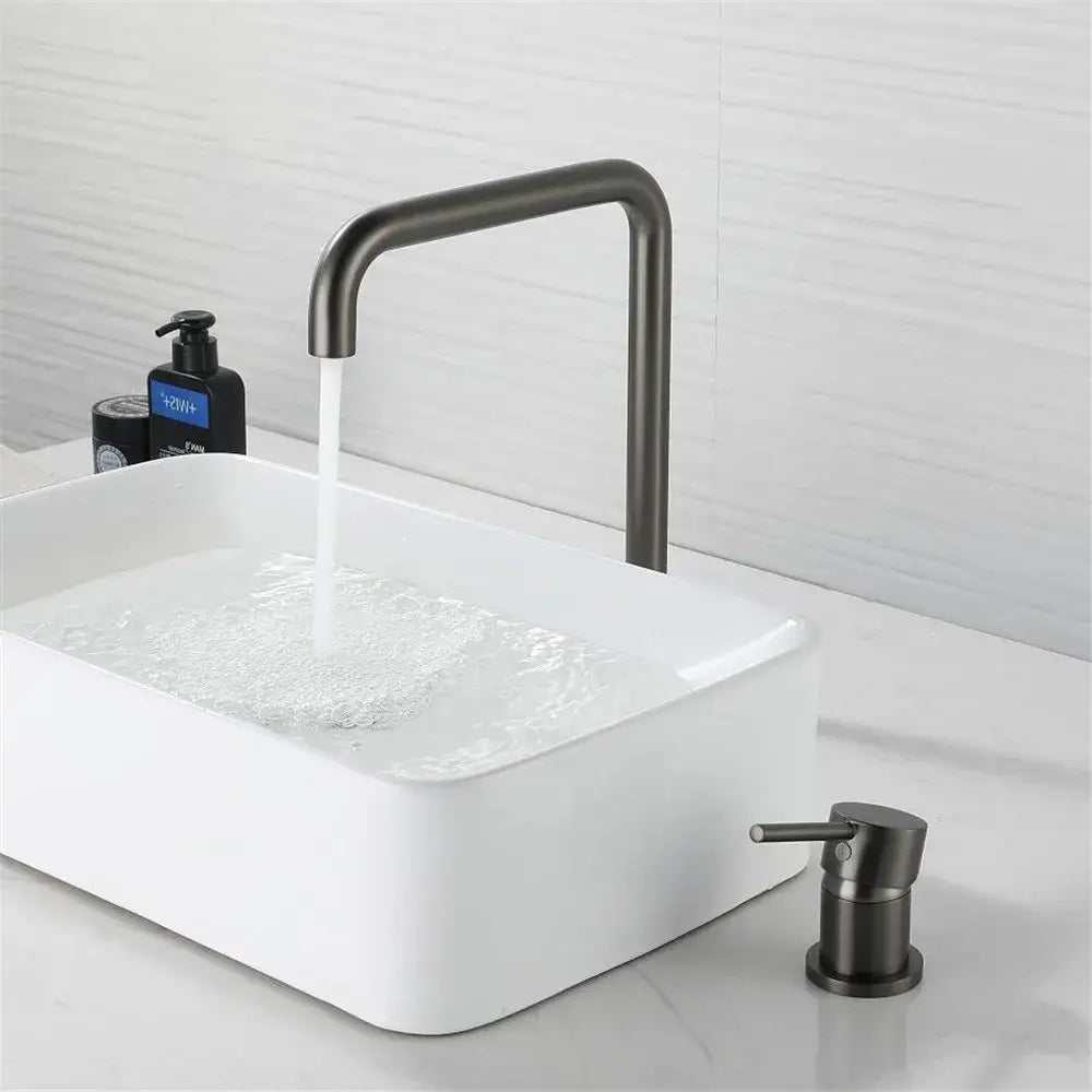 Modern decorbites gun grey rotating kitchen sink tap with a sleek matte black curved spout and matching soap dispenser