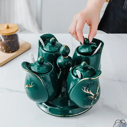 Modern deep green ceramic seasoning set with rotatable spice jars featuring gold deer motifs and built-in spoons