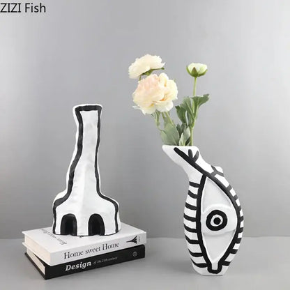 White ceramic fish-shaped vase with black geometric patterns and eye design from decorbites abstract vase set for modern design