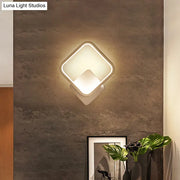 Modern diamond-shaped white led wall lamp with sleek frame and warm diffused lighting for bedroom sconce light