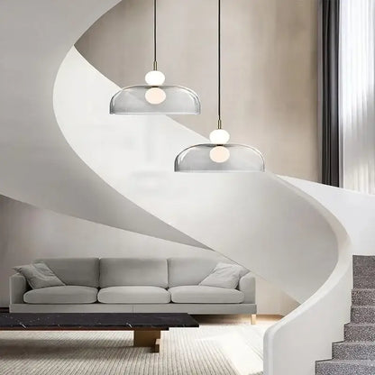 Modern double balls glass chandelier pendant light with frosted white spherical bulbs and black cords above living space