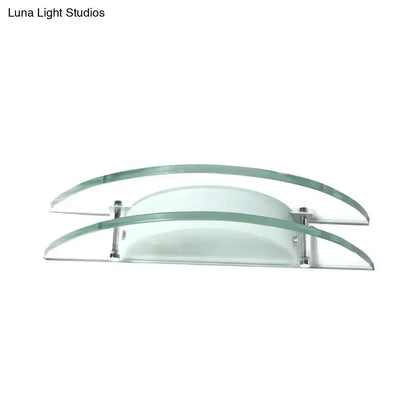 Modern dual arc chrome and green glass wall lamp with clear glass curved panels and direct wired electric installation