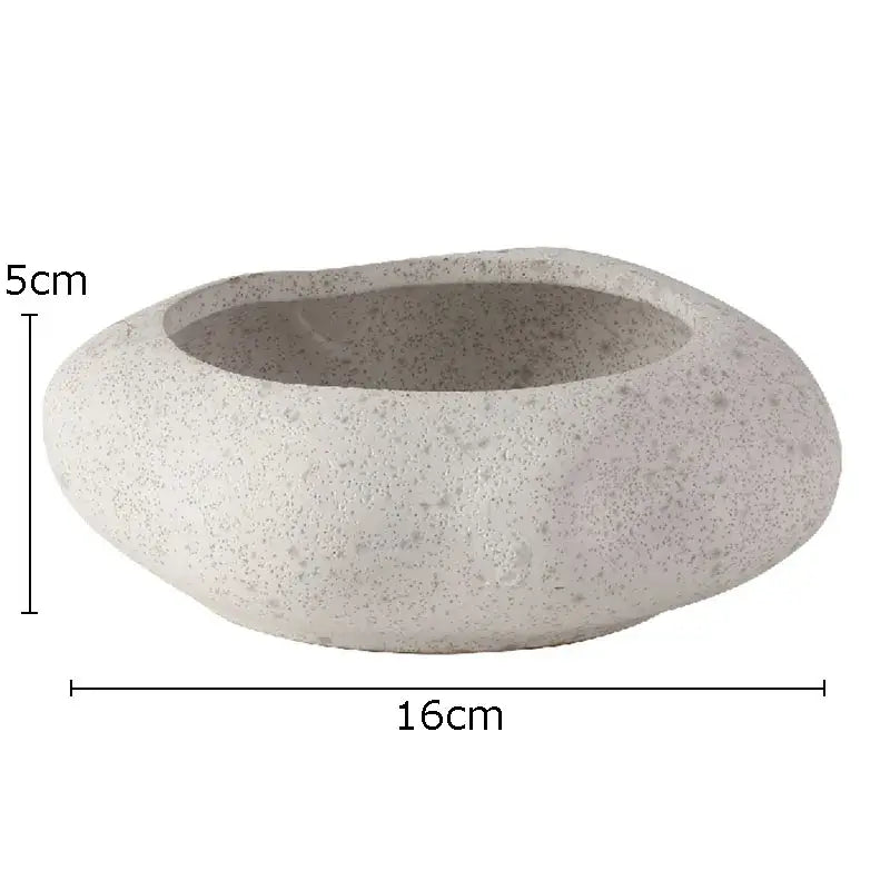 A smooth light gray lotus seedpod ceramic incense burner with speckled texture for modern living room decor