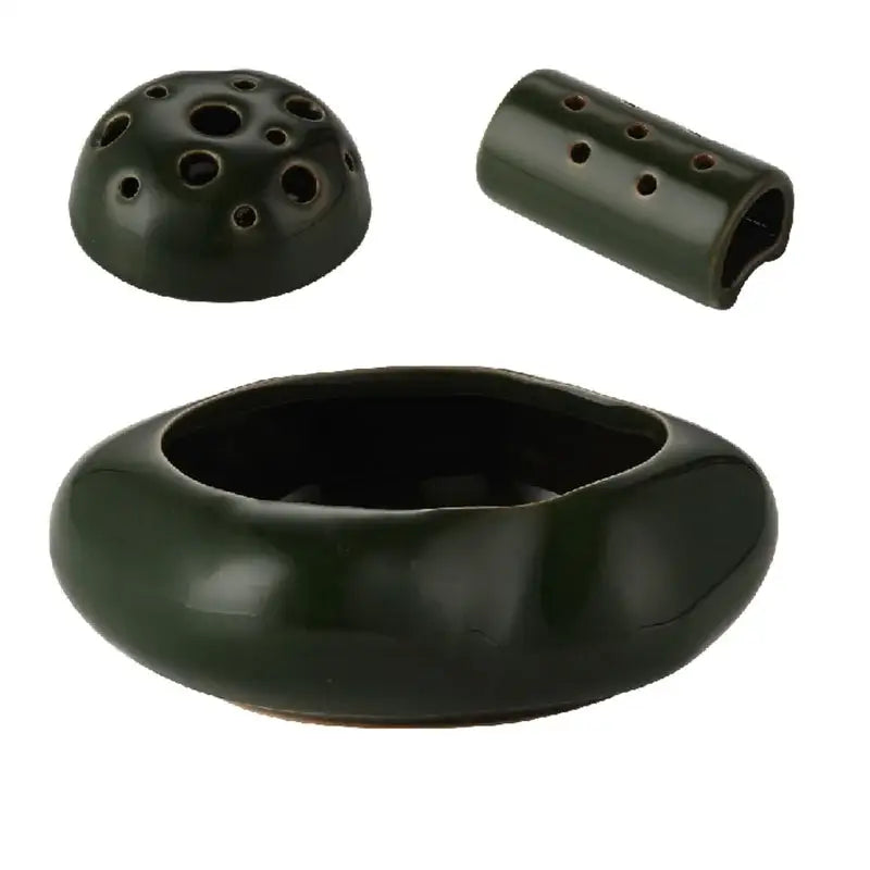 Dark green lotus seedpod ceramic ocarina incense burner with rounded body perforated dome lid for living room decor