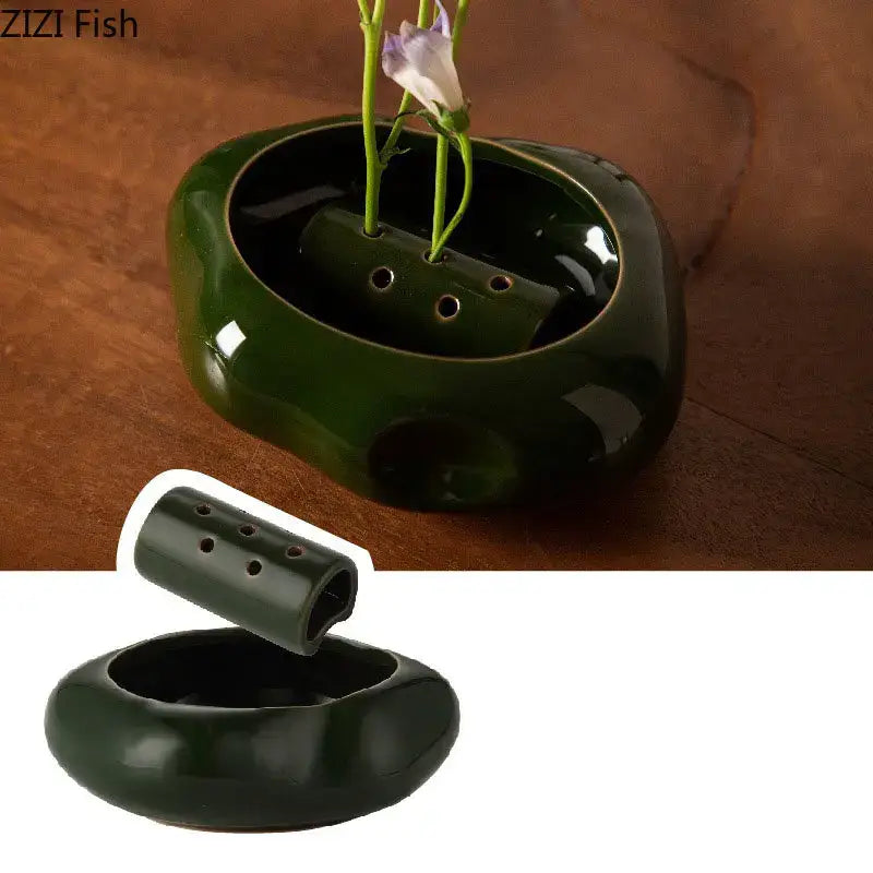 Modern earthy lotus seedpod ceramic incense burner in glossy dark green with small drainage holes for living room decor
