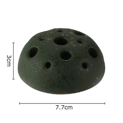 Dark green porous lotus seedpod ceramic incense burner with multiple circular holes for living room decor