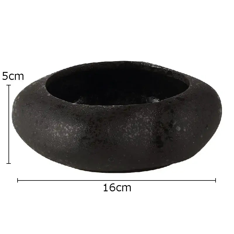 Matte black lotus seedpod ceramic incense burner bowl with textured surface and raised rim for living room decor