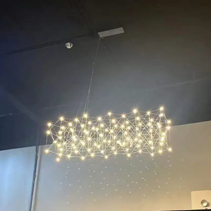 A modern elegant stainless steel geometric led chandelier with warm white lights for dining room decorbites elegant stainless