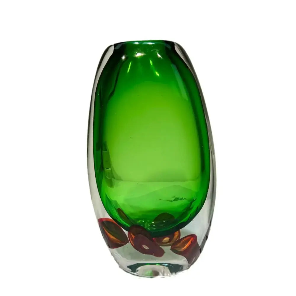 A sleek translucent emerald green glass fruit tray vase with red-orange inclusions for modern decorbites clear fruit decor