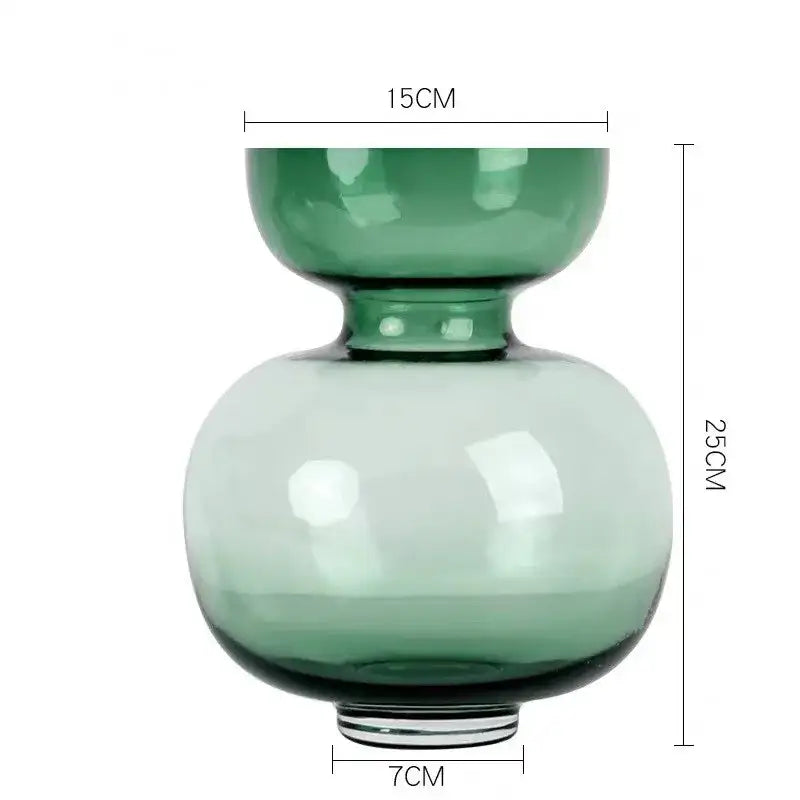 A sleek two-tiered green gourd vase made of glass with a narrow neck for modern living room terrarium use