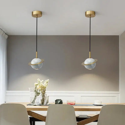 Modern emerald green marble led pendant lamp featuring two gold finished pendant lights with white glass globes