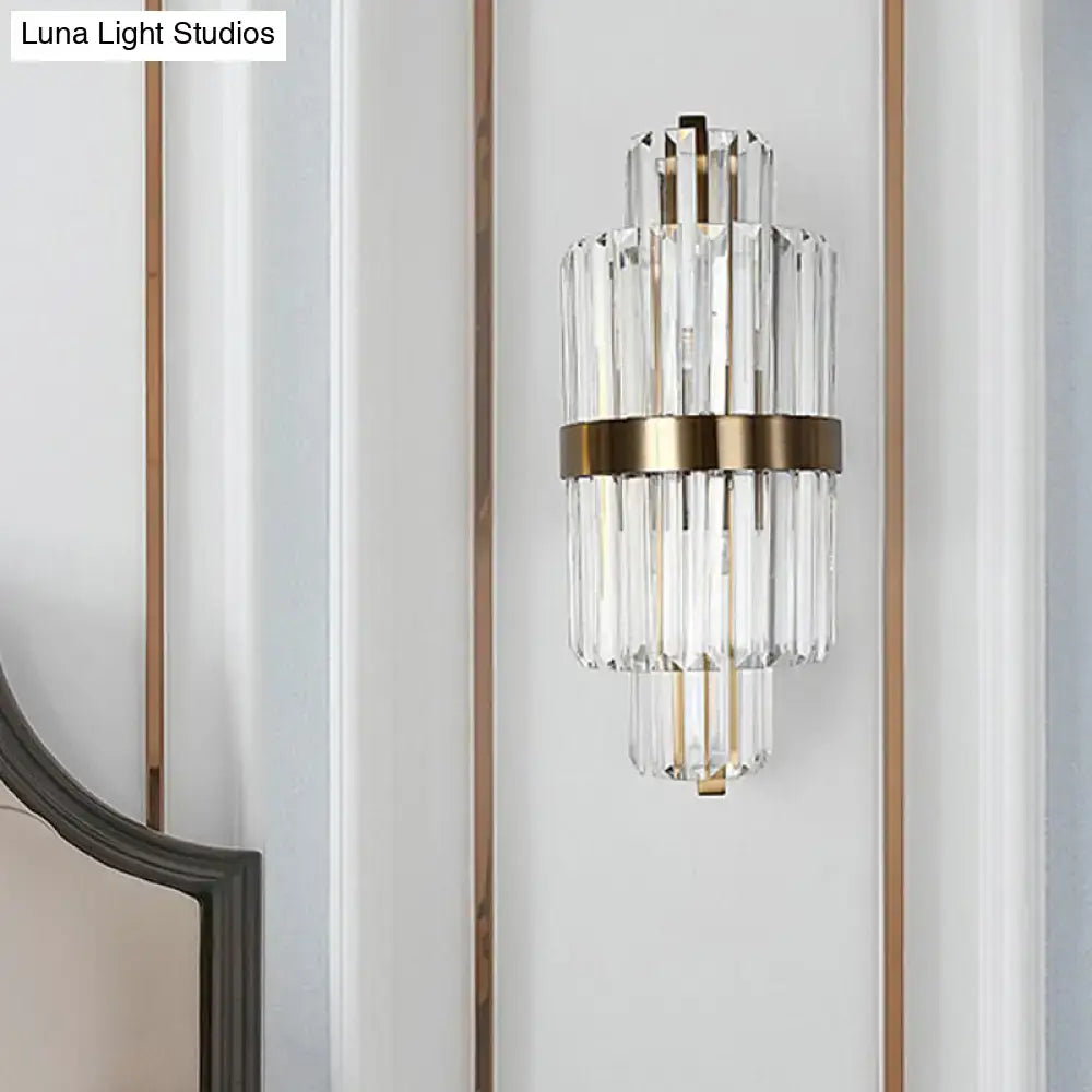 Modern faceted crystal bronze wall light with two lights featuring stacked clear crystal rods and brushed brass frame