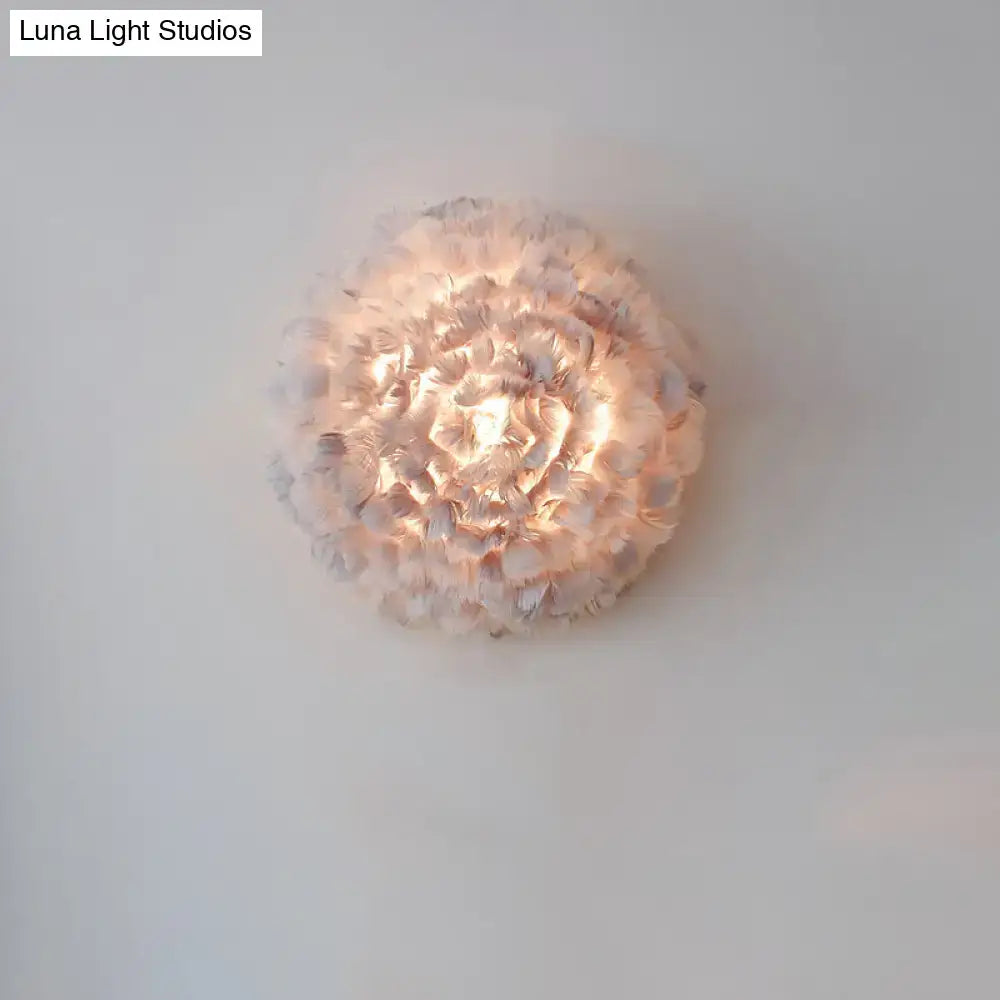 Modern feather material wall light in grey and white with layered translucent petals for bedroom sconce lighting