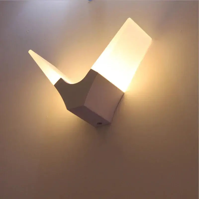 Modern flame acrylic led wall light with matte white finish and warm diffused lighting for living room decorbites acrylic led wall