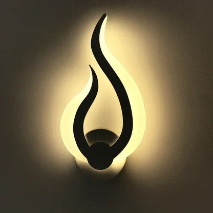 Modern flame acrylic led wall light with sleek black silhouette and warm white backlight for living room decorbites acrylic led wall