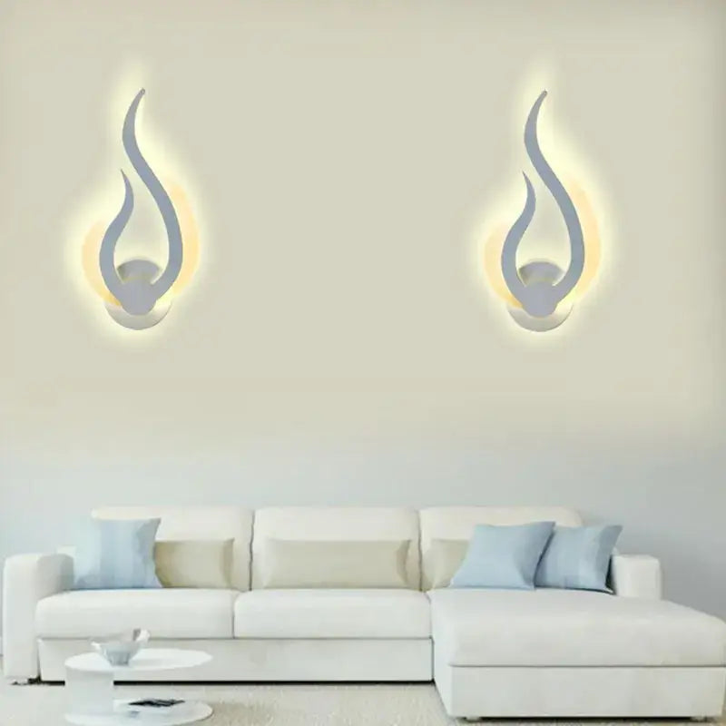 Modern flame acrylic led wall light with sleek silver finish and warm glowing light for living room decorbites acrylic led wall