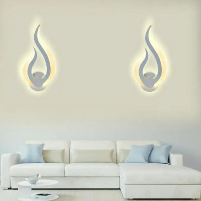 Modern flame acrylic led wall light with sleek silver finish and warm glowing light for living room decorbites acrylic led wall