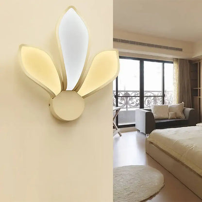 Modern cream-colored wall sconce with simple acrylic panels emitting neutral white warm light for bedroom use