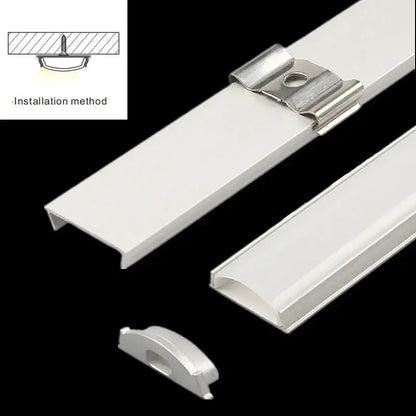 White aluminum profiles with matching mounting clips for flexible led strip lights ideal for modern kitchen lighting