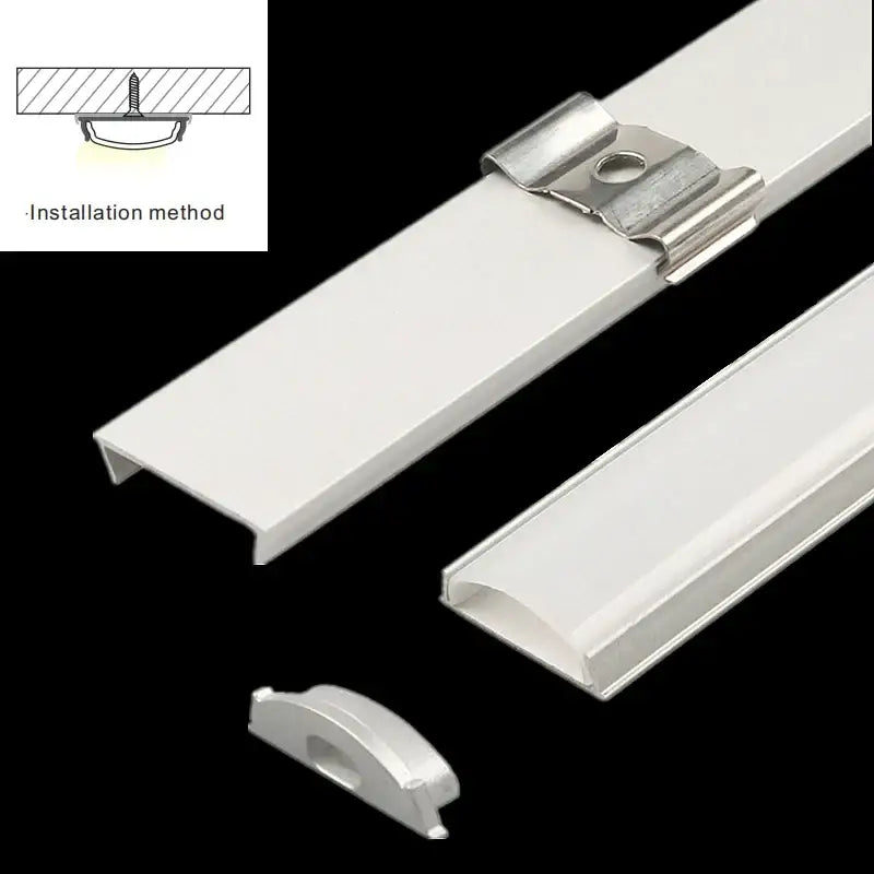 White aluminum profiles with matching mounting clips for flexible led strip lights ideal for modern kitchen lighting