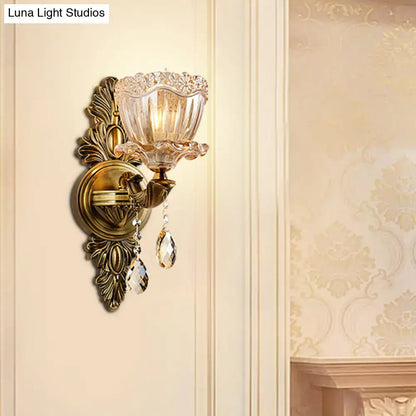 Antique brass modern floral wall sconce with teardrop crystal drop and amber faceted glass shade for living room