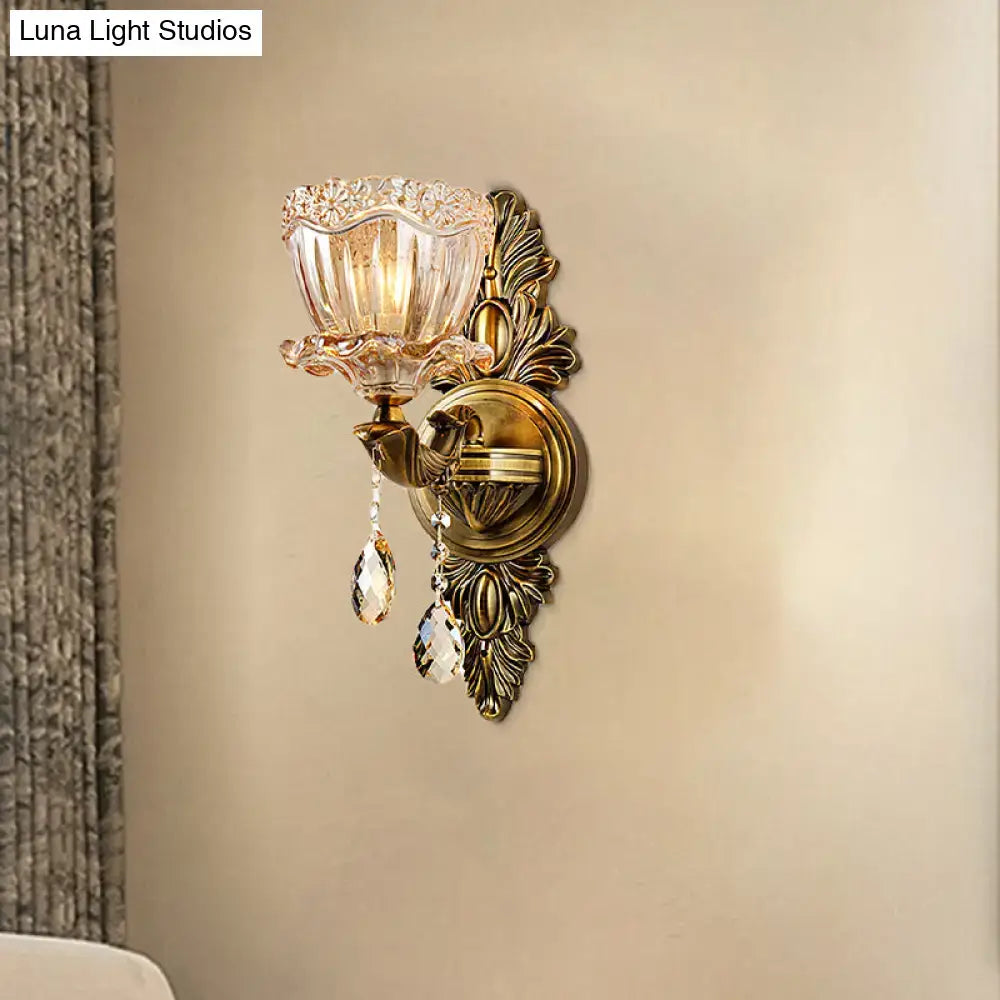 Antique brass modern floral wall sconce with amber faceted glass shade and teardrop crystal drop for living room