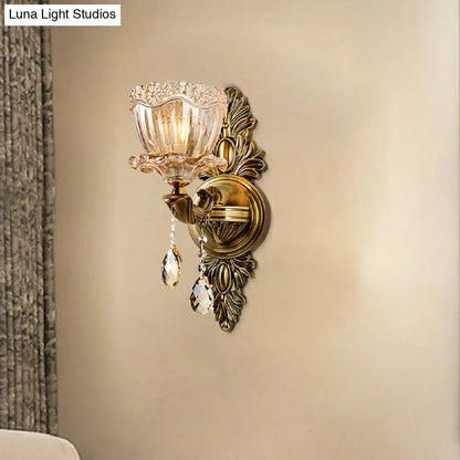 Antique brass modern floral wall sconce with amber faceted glass shade and teardrop crystal drop for living room