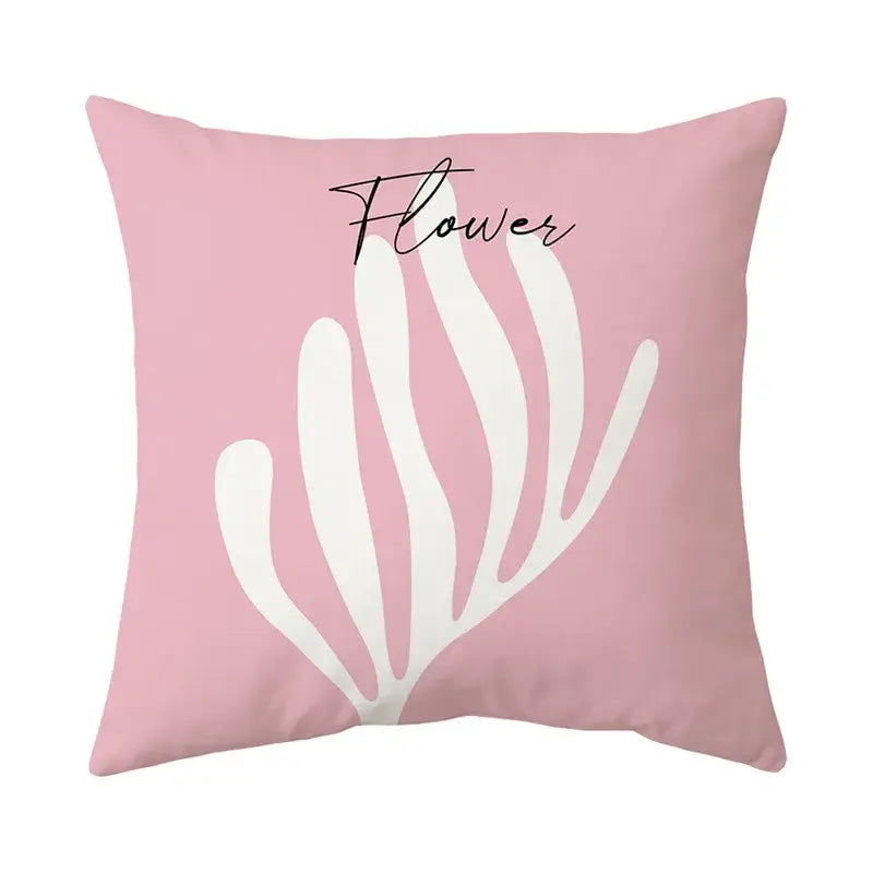 Pink square decorbites butterfly pillowcase with white stylized flower design and black cursive flower text for living room decor