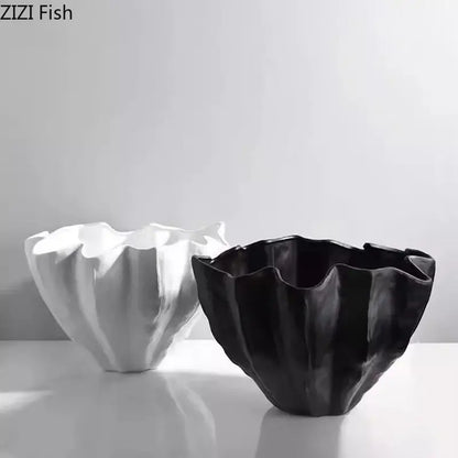 Black resin bud vase with a modern fluted ruffled rim and glossy finish for bedroom decor by decorbites black resin