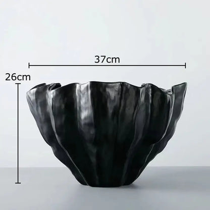 Modern fluted black resin bud vase with glossy finish and ruffled edges for decorbites black resin floral decor