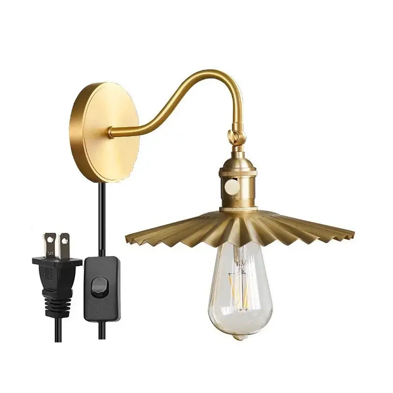 Modern fluted brass adjustable copper wall sconce with petal-like shade and exposed edison bulb for bedroom lighting