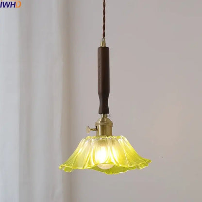 A warm amber pendant light with fluted yellow glass and a led walnut copper handle for modern decorbites decor