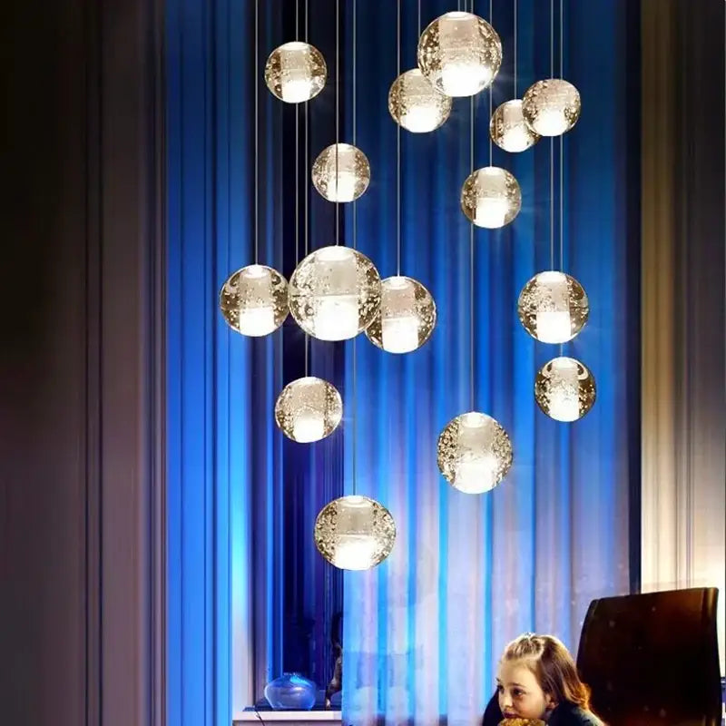 Modern frosted crystal ball chandelier pendant light with warm internal lighting and textured glass orbs for staircase decorbites decor