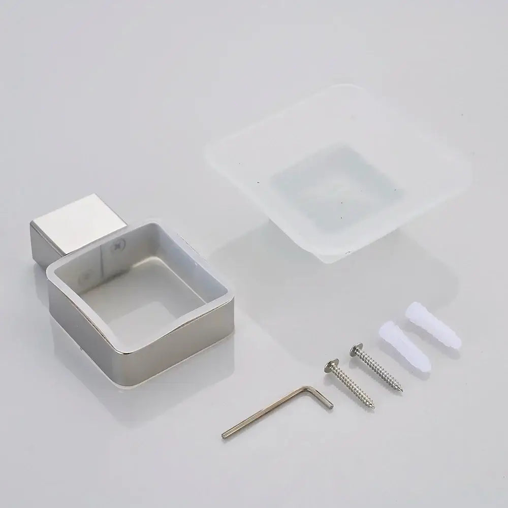 Silver square wall-mounted soap holder with polished metal finish complements decorbites black finish wall bathroom design