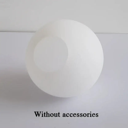 Modern frosted glass ball pendant light with gold ring featuring a white matte glass ball with circular cutout decorbites glass ball