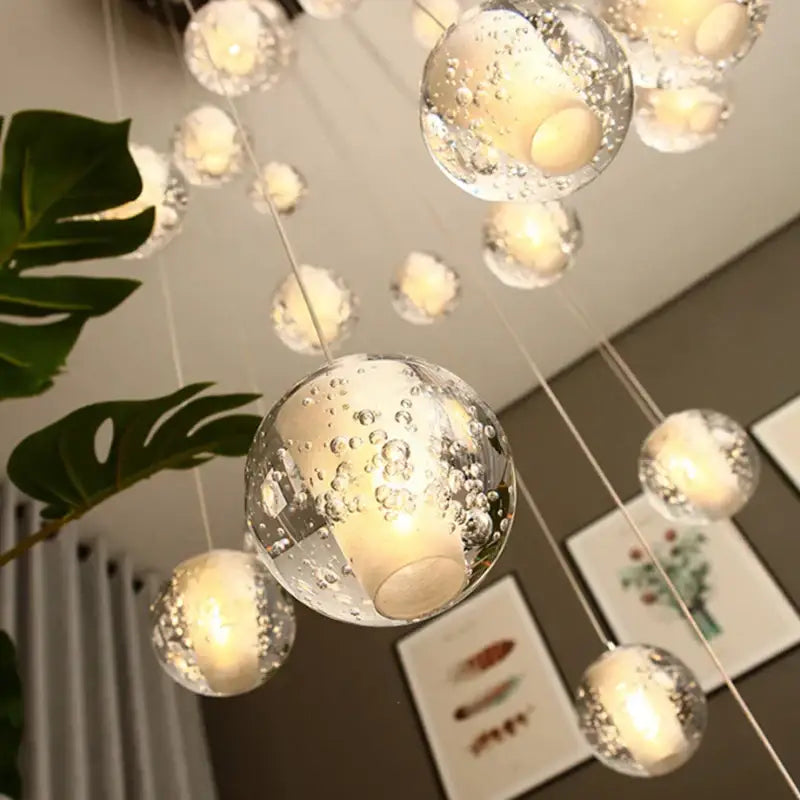 Modern frosted glass crystal ceiling chandelier with clear glass spheres and warm led lights by decorbites crystal ceiling