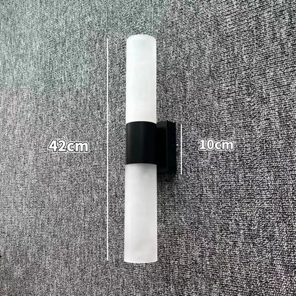 Modern minimalist led wall lamp with frosted glass cylinder and black metal bracket for bedroom sconce lighting